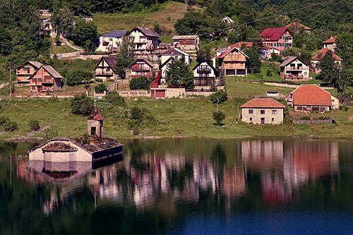 The half-submerged Church of St. Nicholas in Lake Mavrovo